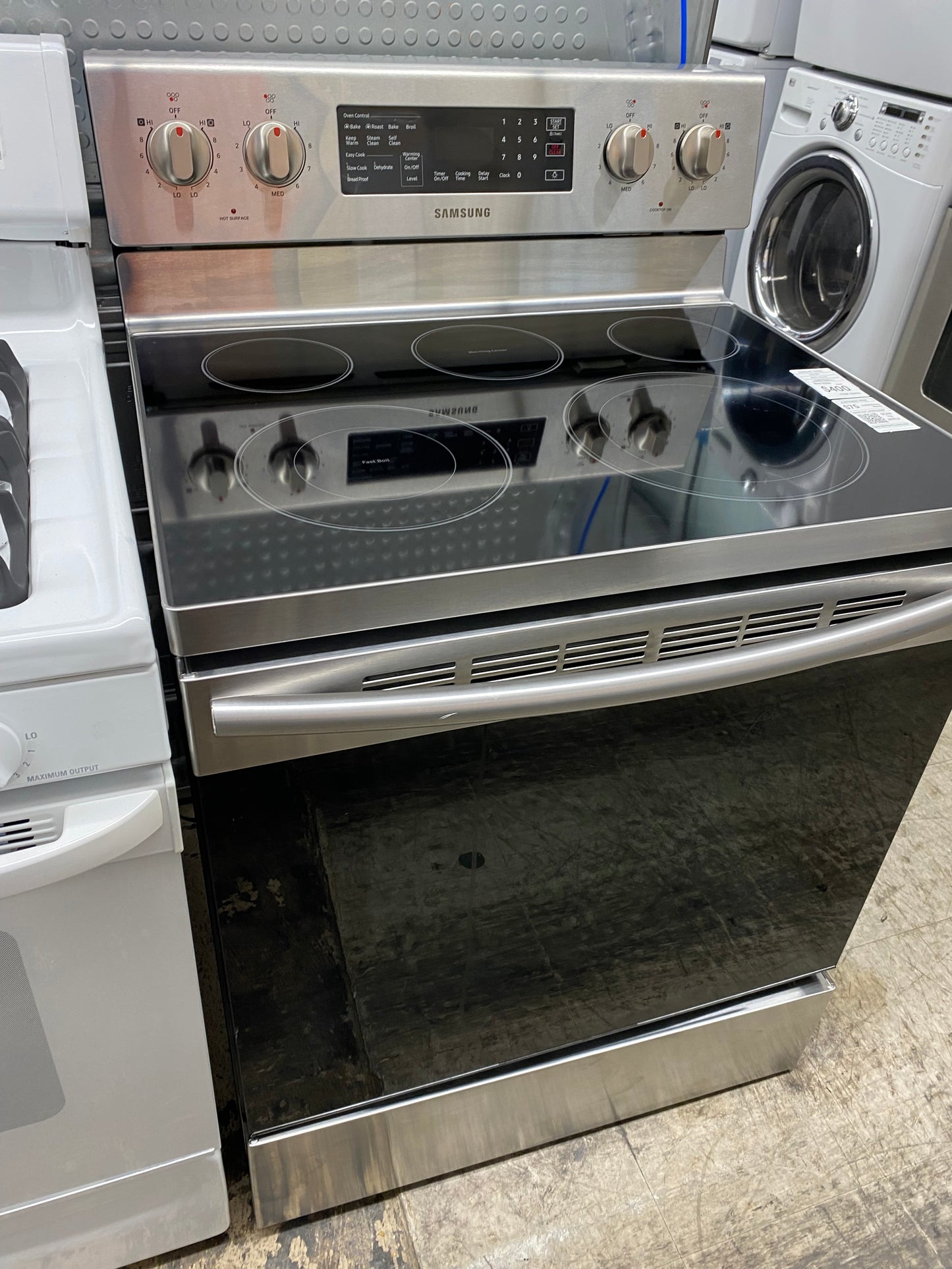 Item: #ER85D Samsung electric range 5 burner  Stainless Steel convection 30 in